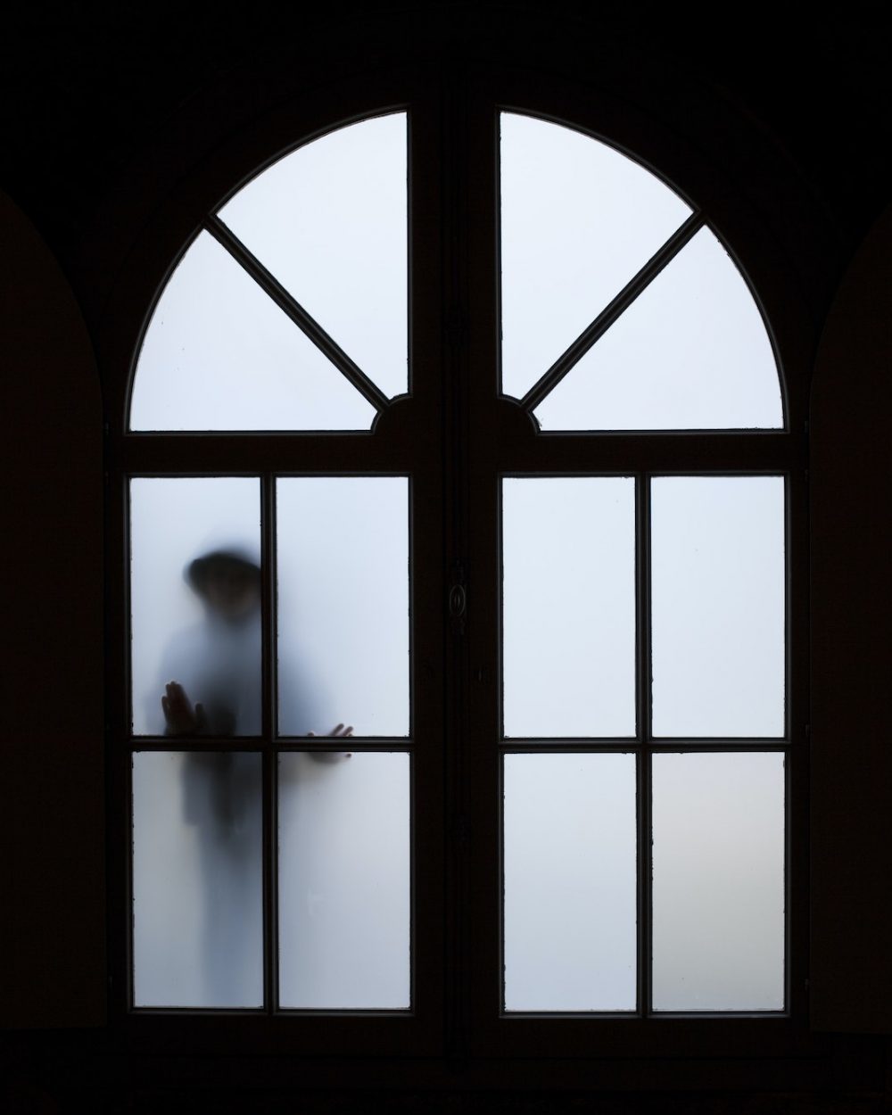 Silhouette near a window